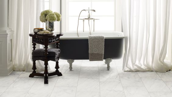 beautiful tile flooring in an elegant white bathroom